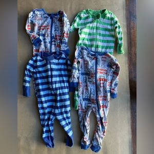 Bundle of 4 pajamas: 2 are 6-9m, 2 are 9-12 (see pics). Hanna and Tea brands.